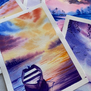 May include: A watercolour painting of a purple boat on a lake with a sunset sky. The sky is a mix of purple, orange, and yellow. The boat is in the lower centre of the image.
