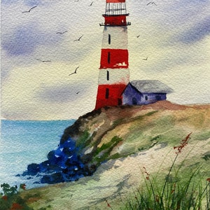 May include: Watercolour painting of a red and white lighthouse on a cliff overlooking the sea. The sky is a light blue with white clouds. There are several birds flying in the sky.