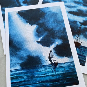 May include: A watercolour painting of a sailboat on a dark blue sea with a stormy sky. The sailboat is silhouetted against the clouds, and the water is calm and reflective.