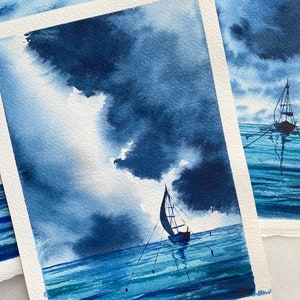 May include: A watercolour painting of a sailboat on a calm blue sea with a dark blue cloudy sky. The sailboat is anchored in the water with ropes attached to buoys.