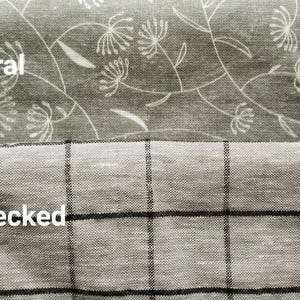 May include: Two gray fabric swatches. The top swatch features a floral pattern with white accents, labeled "Gray floral." The bottom swatch is a gray checked pattern, labeled "Gray checked."