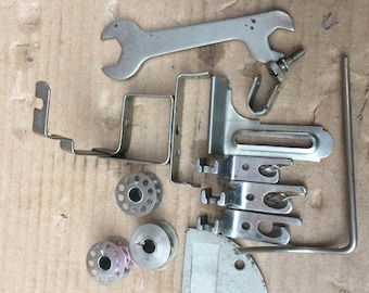 Vintage Italian Necchi sewing machine accessories and paperwork