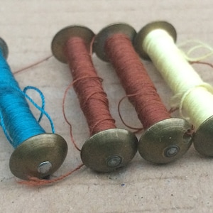 Jones family vibrating shuttle sewing machine Bobbins x 4