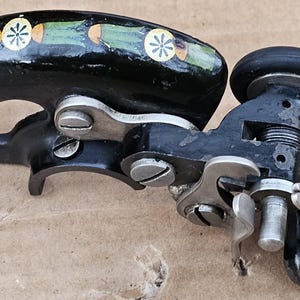 Antique Singer 66K Lotus sewing machine belt guard with bobbin winder
