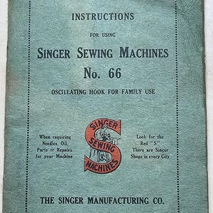 May include: A green instruction booklet for a Singer Sewing Machine model No. 66. The booklet has the text "Singer Sewing Machines No. 66 Oscillating Hook for Family Use" and a red Singer logo with the text "Singer Sewing Machines".