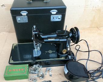 221K Singer Featherweight Sewing Machine with accessories.