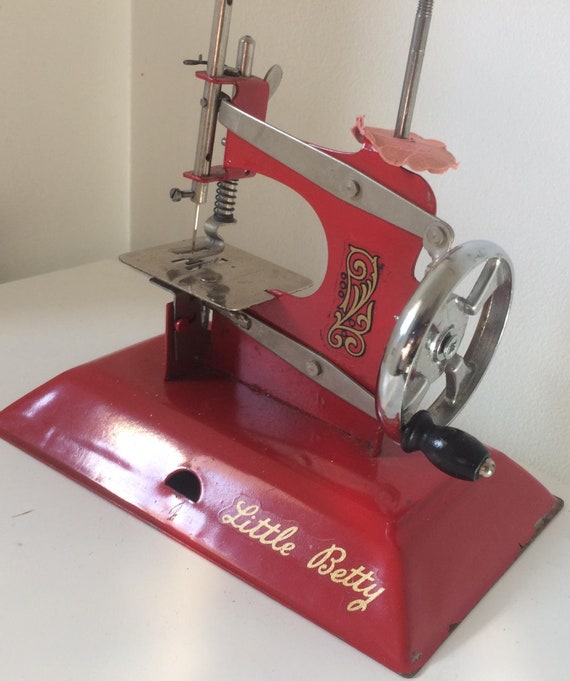 Red Vintage Little Betty Toy, Child's Hand Crank Chain Stitch