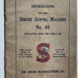 May include: A vintage Singer Sewing Machine instruction manual for model number 66. The cover is brown with black text and a red Singer Sewing Machines logo. The text reads "Instructions for Using Singer Sewing Machine No. 66 Oscillating Hook for Family Use".