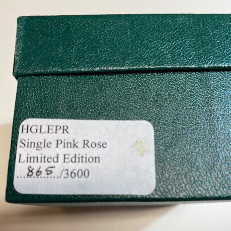 May include: A green box with a white label that reads "HGLEPR Single Pink Rose Limited Edition 865/3600".