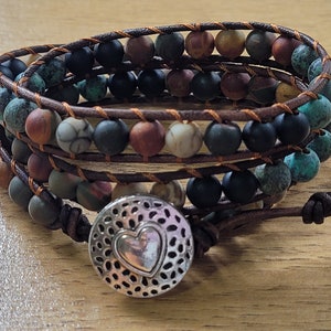 Stunning Multi- Layered Boho Bracelet.  Adjustable bracelet with Multi-coloured stones entwined with Leather.