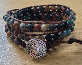 Stunning Multi- Layered Boho Bracelet.  Adjustable bracelet with Multi-coloured stones entwined with Leather.