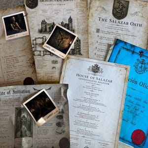 May include: A collection of aged, parchment-style documents including the Sacred Subject Intake Register, The Salazar Oath, and House of Salazar Genealogical Register. Several small square photographs are placed on top of the papers.