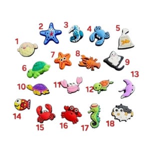 May include: A selection of colourful sea creature charms, including a starfish, seahorse, crab, and turtle. The charms are in various colours, such as blue, green, orange, and pink. These charms are ideal for crafting or adding to accessories.