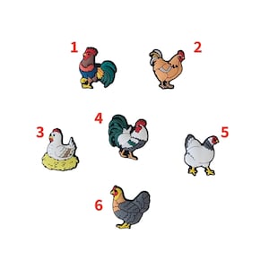 May include: A selection of six colourful chicken-themed charms. The charms depict various chicken and rooster designs, including a hen on a nest, and roosters with vibrant plumage. Each charm is numbered for easy selection.
