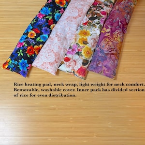 May include: A set of three ceramic canisters with lids. The canisters are white with a blue floral pattern. The largest canister is 8 inches tall, the medium is 7 inches, and the smallest is 6 inches.