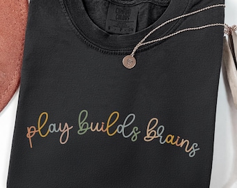 Rainbow Boho Motivational Shirt: Play Builds Brains Shirt, RTT Tee, Play Therapy Inspirational Teacher Shirt, Child Life Education Sweater