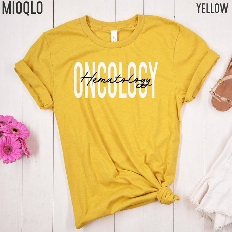 May include: Yellow t-shirt with the text "ONCOLOGY" in white and "Hematology" in black script.