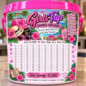 May include: A pink plastic bucket featuring a Girls Trip Savings Challenge graphic with a tropical theme, including palm trees, hibiscus flowers, a suitcase, a passport, and a grid of 100 circles labeled $10 to save $1,000 total.