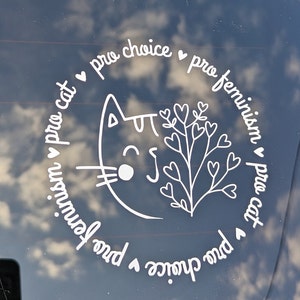 May include: White vinyl sticker with a cat illustration and the text "pro choice &hearts; pro feminism &hearts; pro cat &hearts; pro choice &hearts; pro feminism &hearts; pro cat" in a circle.