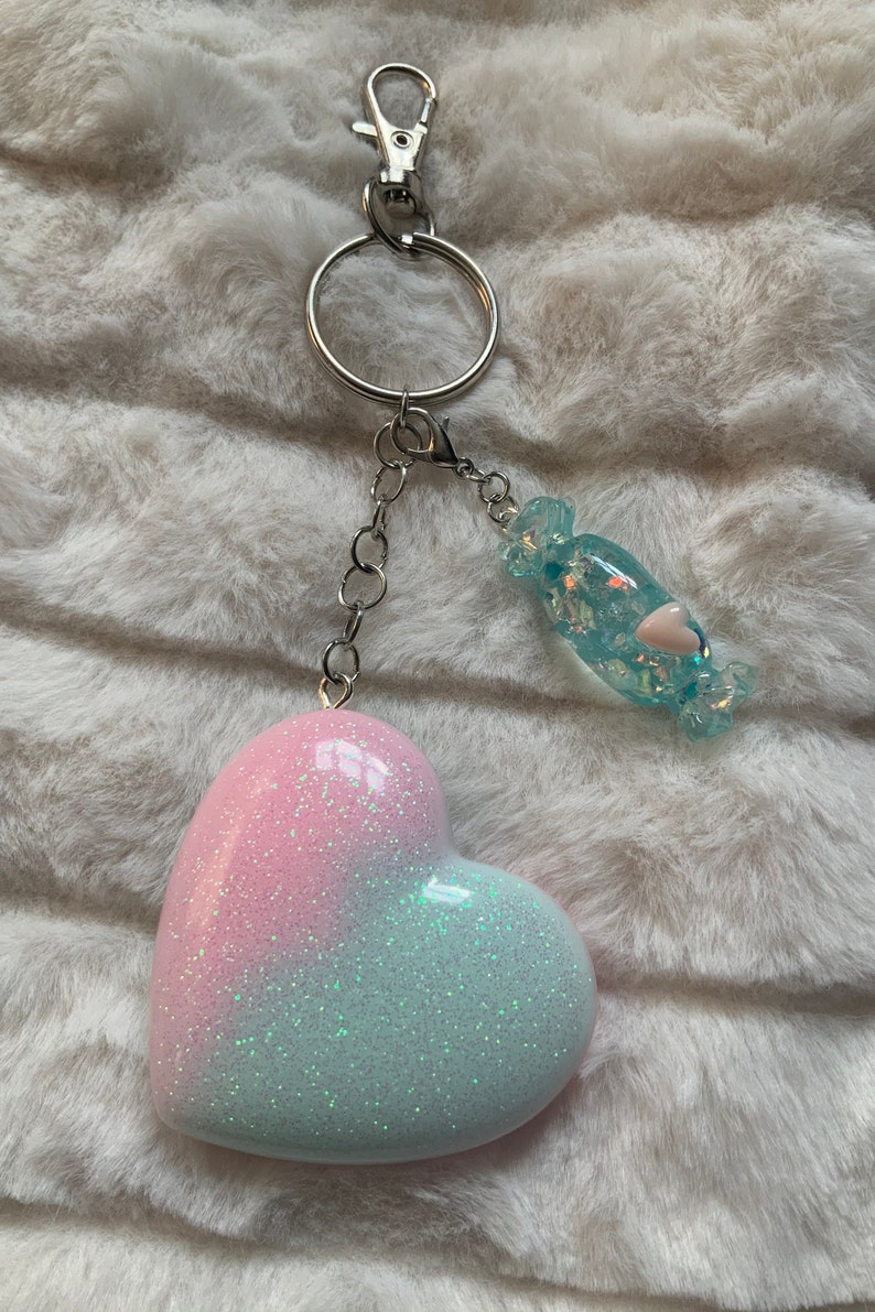 Pastel pink and blue iridescent glitter heart shaped keyring