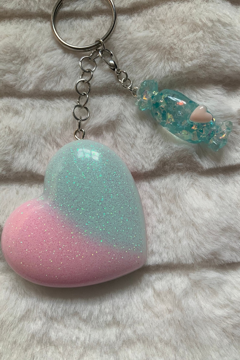 Pastel pink and blue iridescent glitter heart shaped keyring