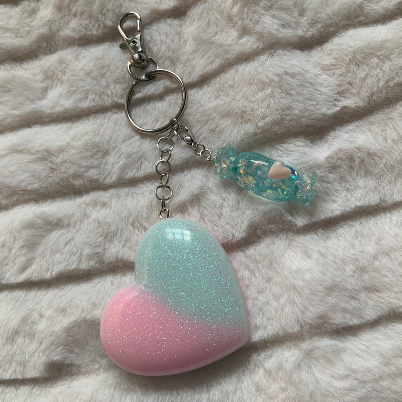 Pastel pink and blue iridescent glitter heart shaped keyring