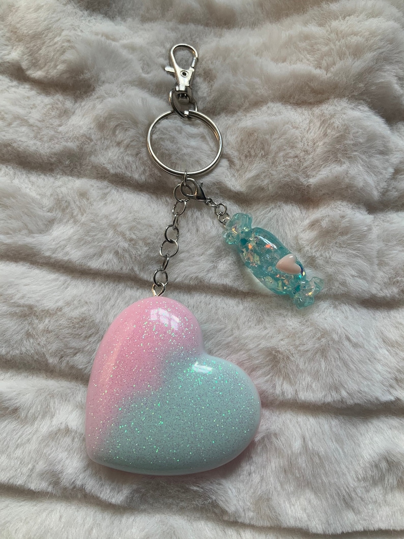 Pastel pink and blue iridescent glitter heart shaped keyring