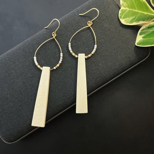 White ear danglers, Wood earrings, Beaded hoops, White and gold earrings, Drop and dangle, Brass ear danglers, Modern earrings, ME47