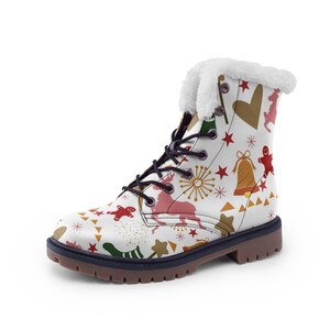 May include: White winter boot with a festive pattern of reindeer, gingerbread men, bells, and stars. The boot has a black lace-up closure, a brown sole, and a fluffy white trim around the top. The boot is designed for cold weather.