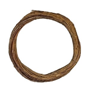 May include: A circular wreath base made of interwoven brown twigs. The wreath is tightly bound, creating a sturdy foundation for crafting seasonal or decorative displays. The natural, earthy tones offer a rustic aesthetic.
