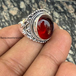 Stunning red ring with intricate design