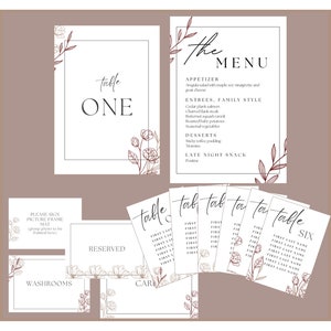 May include: Wedding stationery set featuring floral illustrations. The set includes table numbers, a menu, place cards, and signs for the picture frame mat, reserved seating, washrooms, and cards. The text is in a simple font.