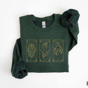 Immerse yourself in the mystical world of astrology and tarot with our beautifully designed Celestial Zodiac T-Shirt. This stylish tee captures the essence of the stars with its unique tarot card graphics, featuring classic zodiac symbols.