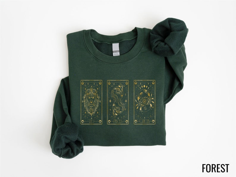 Immerse yourself in the mystical world of astrology and tarot with our beautifully designed Celestial Zodiac T-Shirt. This stylish tee captures the essence of the stars with its unique tarot card graphics, featuring classic zodiac symbols.