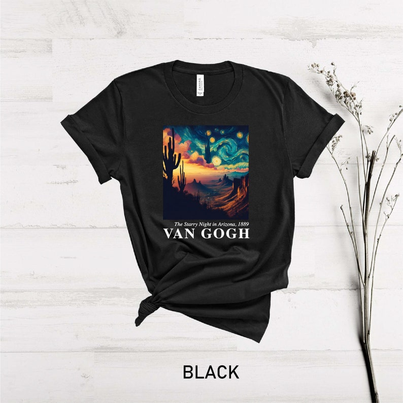 May include: Black t-shirt with a graphic print of a starry night sky with a desert landscape and the text "The Starry Night in Arizona, 1889" and "VAN GOGH".
