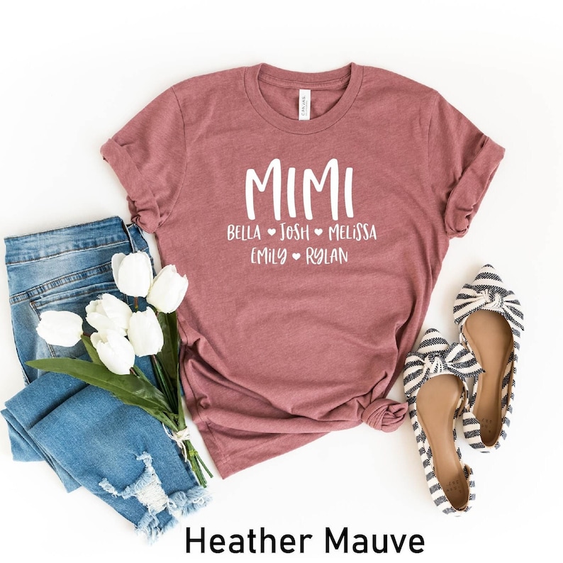 May include: Heather mauve t-shirt with the word "MIMI" and the names Bella, Josh, Melissa, Emily, and Rylan printed in white on the front.