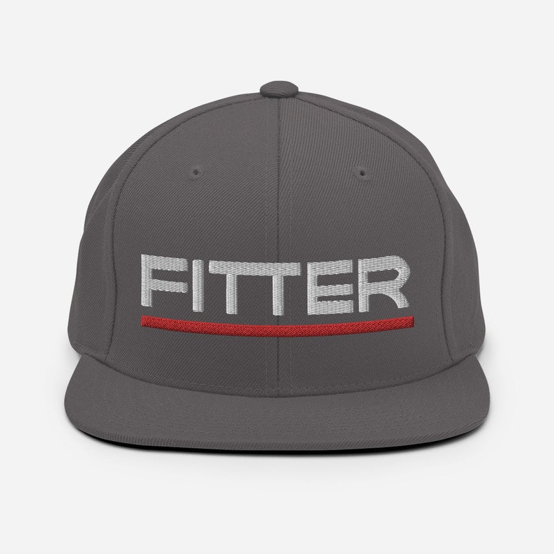 May include: A charcoal gray fitted baseball cap with a white embroidered word "FITTER" and a red stripe underneath.