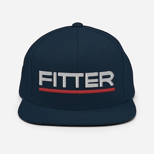 May include: A navy blue fitted baseball cap with a white embroidered "FITTER" logo and a red stripe underneath.