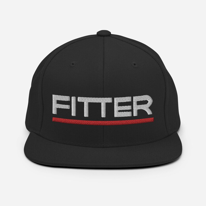 May include: Black fitted baseball cap with a white embroidered "FITTER" logo and a red stripe below it.