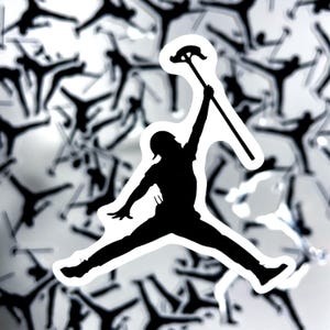 May include: A black silhouette sticker featuring a person in a dynamic jumping pose, wearing a cap and holding a conduit bender tool high in the air with one arm extended, set against a repeating pattern of identical black silhouette stickers.