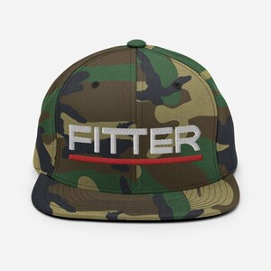 May include: A camouflage-patterned baseball cap with a black brim and a white embroidered word "FITTER" with a red line underneath.