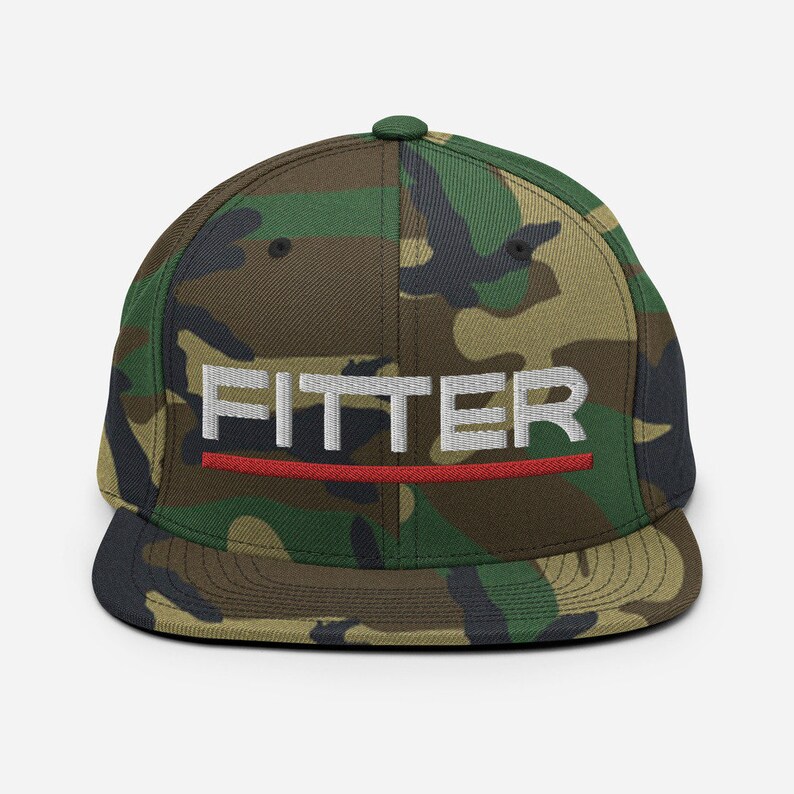 May include: A camouflage-patterned baseball cap with a black brim and a white embroidered word "FITTER" with a red line underneath.