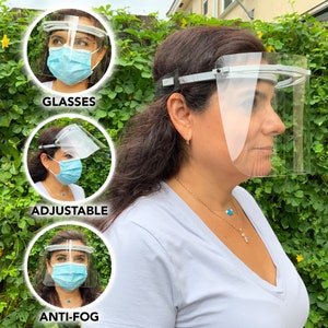 May include: A clear plastic face shield with an adjustable headband. The shield is designed to be worn over glasses and has an anti-fog coating. The text "GLASSES", "ADJUSTABLE", and "ANTI-FOG" is visible in the image.