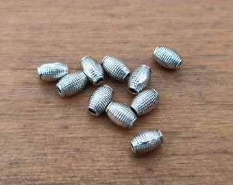 Interlayer in the form of metal barrels of ancient silver color, lot of 11.