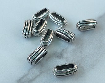 5 Perles passantes motif rayures en métal argenté