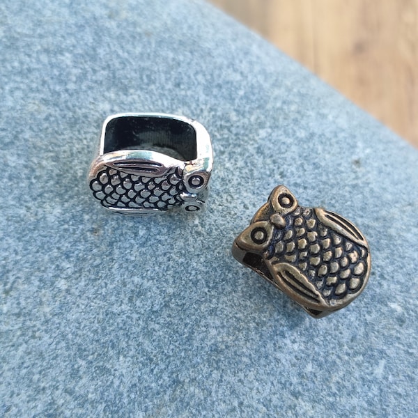 Perles passantes pour cuir regaliz de forme Hibou 10 x 8mm.