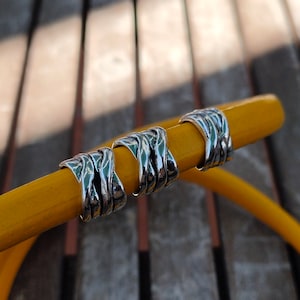 4 intertwined ethnic passers-by beads for regaliz leather.