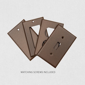 Placas para interruptores de acero inoxidable fundido con recubrimiento de polvo color bronce frotado con aceite: tamaño estándar, mediano y extragrande.
