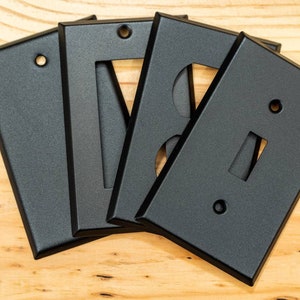 Rustic Black Cast powder coated Toggle, Rocker, Duplex, and Blank standard size metal switch plates.