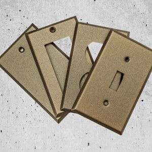 Bronze Cast powder coated Toggle, Rocker, Duplex, and Blank metal switch plates- available in standard size, mid-size, and over-sized styles